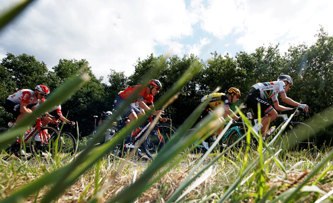 Lotto Soudal rider Tiesj Benoot of Belgium, Bahrain-Merida rider Ivan Garcia Cortina of Spain, Team Jumbo-Visma rider Tony Martin of Germany and Mitchelton-Scott rider Daryl Impey of South Africa ride in the breakaway at the 170.5-km Stage 9 from Saint-Etienne to Brioude on July 14