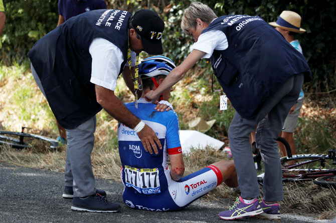 Total Direct Energie rider Niki Terpstra of the Netherlands receives medical attention after a crash on the 167-km Stage 11 from Albi to Toulouse on July 17