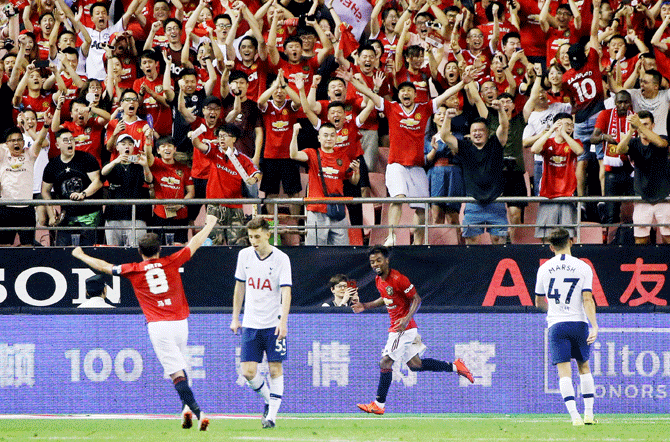 Manchester United's Angel Gomes celebrates scoring their second goal against Tottenham Hotspur during their International Champions Cup in Shanghai, China, on Thursday