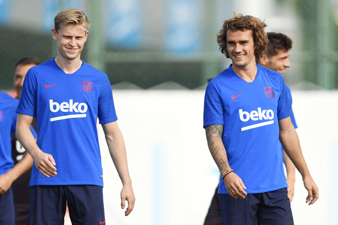 Barca's new signings Frenkie de Jong (left) and Antoine Griezmann during a training session