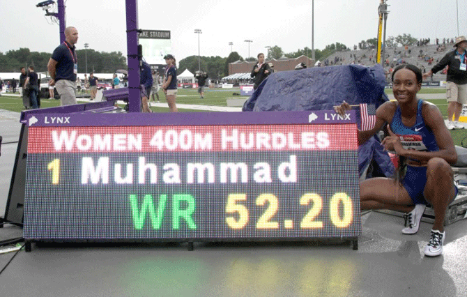 Dalilah Muhammad poses with scoreboard after winning the women's 400m hurdles in a world record 52.20 during the USATF Championships at Drake Stadium in Des Moines, Iowa in USA on Sunday