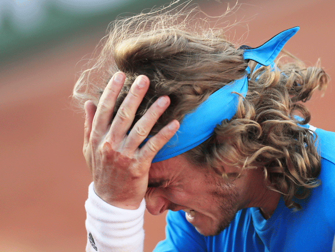 Greece's Stefanos Tsitsipas is a picture of frustration during his French Open fourth round match against Switzerland's Stan Wawrinka at Roland Garros on Sunday