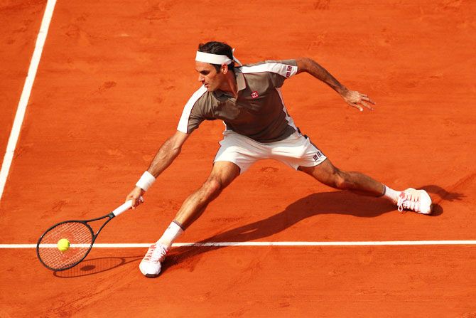 Switzerland's Roger Federer returns during his men's singles quarter-final against compatriot Stan Wawrinka on Tuesday.