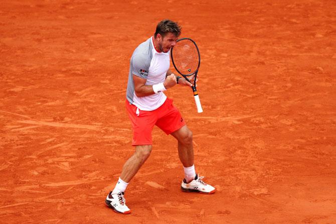 Stan Wawrinka celebrates a point during her match against Roger Federer