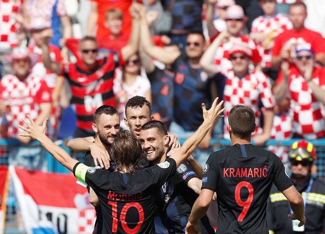  Croat players celebrate their goal against Wales during the 2020 UEFA European Championships Group E qualifying match at Stadium Gradski Vrt in Osijek, Croatia, on Saturday