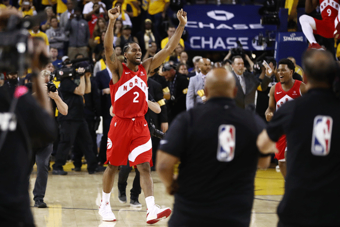 Toronto Raptors' Kawhi Leonard celebrates his team's win over the Golden State Warriors in Game Six to win the 2019 NBA Finals at ORACLE Arena in Oakland, California, on Thursday