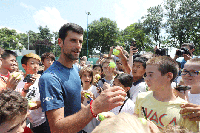 Novak Djokovic of Serbia meets with fans during a training session in Belgrade, Serbia on Wednesday