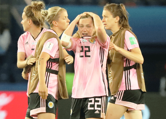 Scotland's Erin Cuthbert and her teammates look dejected after the match against Argentina