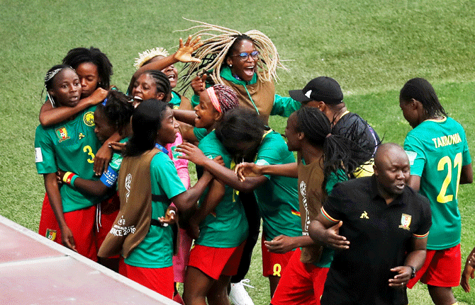 Cameroon's Ajara Nchout celebrates scoring their second goal with teammates