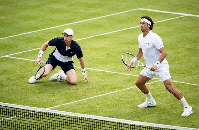 Andy Murray and Feliciano Lopez in action during their doubles match against top seeded-pair of Juan Sebastian Cabal and Robert Farah at the Queen's Club Championships on Thursday