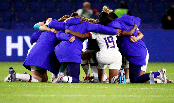United States players huddle after their win over Sweden at Stade Oceane, Le Havre, France, on Thursday