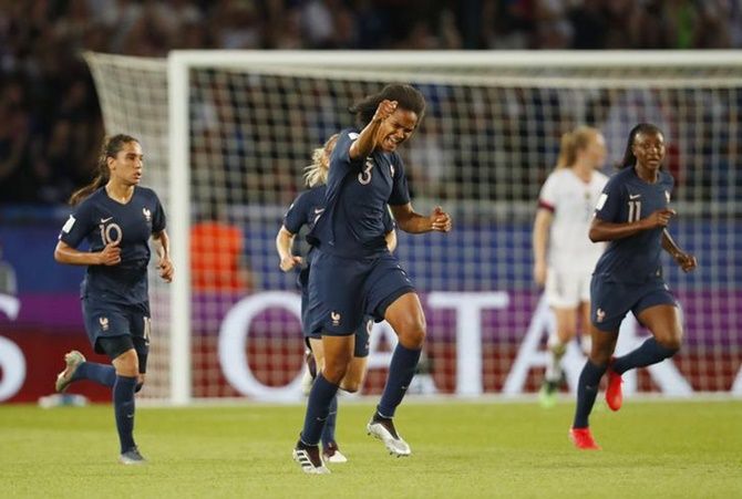 France defender Wendie Renard (3) celebrates after scoring