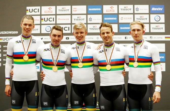 Australia celebrate winning the men's team pursuit final with their gold medals on the podium at the 2019 UCI Track Cycling World Championships in Pruszkow, Poland on Friday