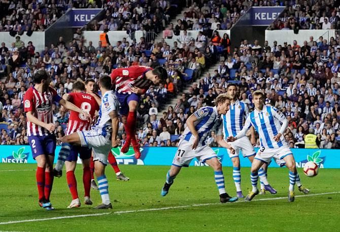 Atletico Madrid's Alvaro Morata heads in to net their second goal against Real Sociedad during their La Liga match at Anoeta Stadium in San Sebastian in Spain on Sunday