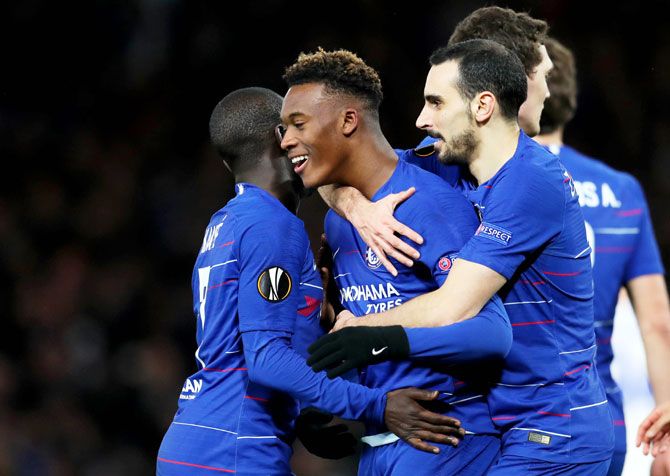 Chelsea's Callum Hudson-Odoi celebrates with teammate Davide Zappacosta after scoring his team's third goal against Dynamo Kyiv during the UEFA Europa League Round of 16 First Leg match at Stamford Bridge in London