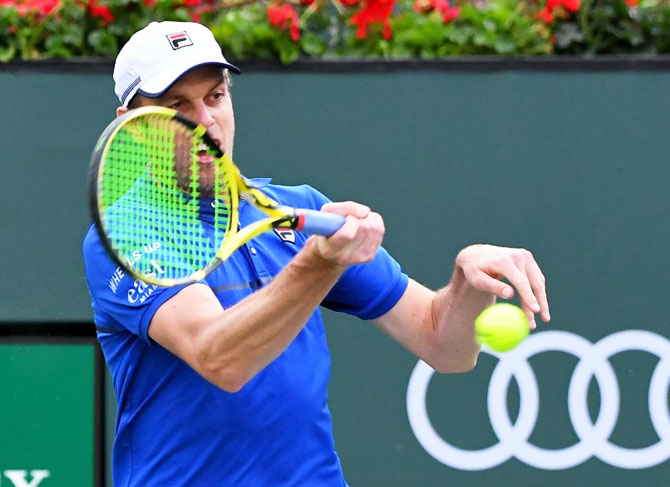 USA's Sam Querrey plays a return during his first round match against Italy's Matteo Berrettini in the BNP Paribas Open at the Indian Wells Tennis Garden on Thursday