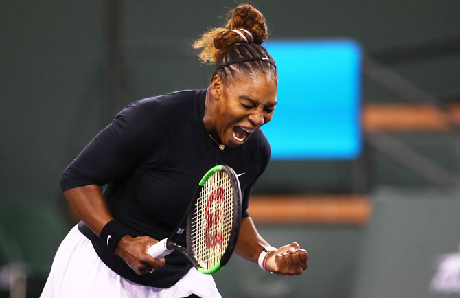 USA's Serena Williams celebrates on winning the first set against Belarus' Victoria Azarenka during their women's singles second round match on Day 5 of the BNP Paribas Open at the Indian Wells Tennis Garden in Indian Wells, California, on Friday
