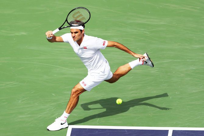 Switzerland's Roger Federer plays a forehand against Germany's Peter Gojowczyk during their men's singles second round match on Day 7 of the BNP Paribas Open at the Indian Wells Tennis Garden in Indian Wells, California, on Sunday