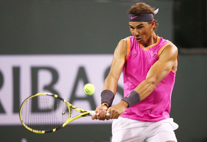 Spain's Rafael Nadal plays a backhand against USA'S Jared Donaldson during their men's singles second round match of the BNP Paribas Open at the Indian Wells Tennis Garden in Indian Wells, California, on Sunday