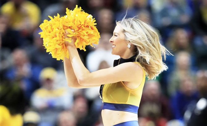 An Indiana Pacers' cheerleader performs during half-time of the game against the Chicago Bulls at Bankers Life Fieldhouse in Indianapolis, Indiana, on Tuesday, March 5