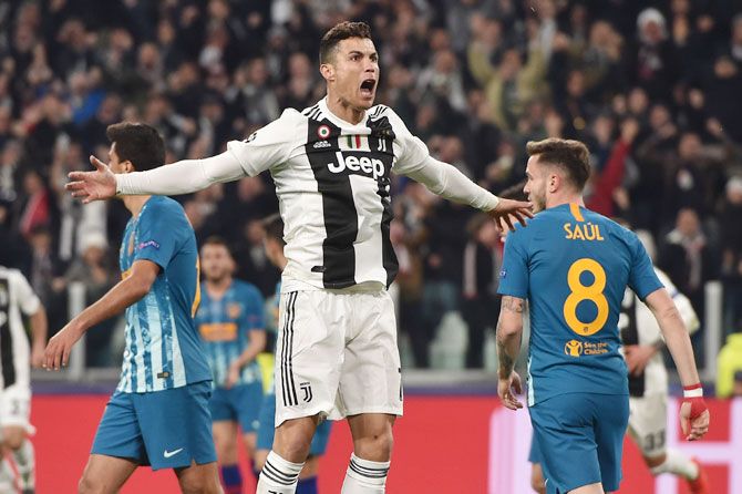 Juventus' Cristiano Ronaldo celebrates after scoring the opening goal against Club de Atletico Madrid during their UEFA Champions League Round of 16 Second Leg match at Allianz Stadium in Turin on Tuesday