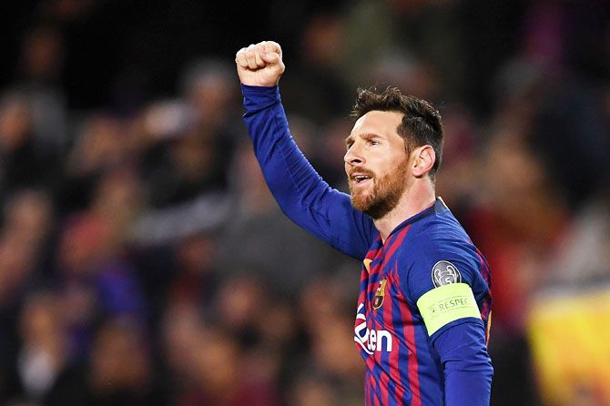 Barcelona's Lionel Messi celebrates scores his team's first goal from a penalty during their UEFA Champions League Round of 16 second leg match against Olympique Lyonnais at Nou Camp in Barcelona on Wednesday