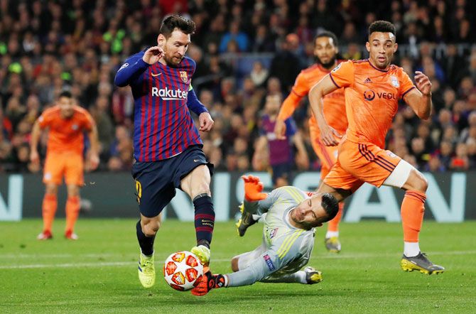 Barcelona's Lionel Messi dribbles past Lyon's Anthony Lopes in their Champions League Round of 16 second leg match at Camp Nou on Wednesday