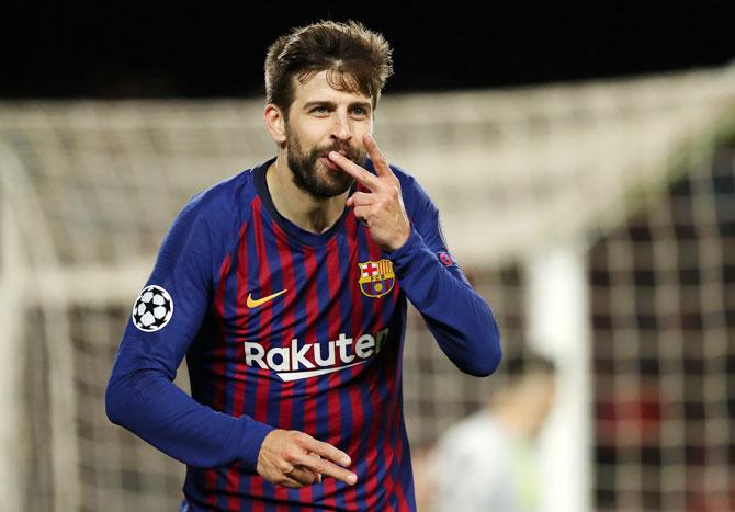 Barcelona's Gerard Pique ceebrates as he scores his team's fourth goal against Olympique Lyonnais