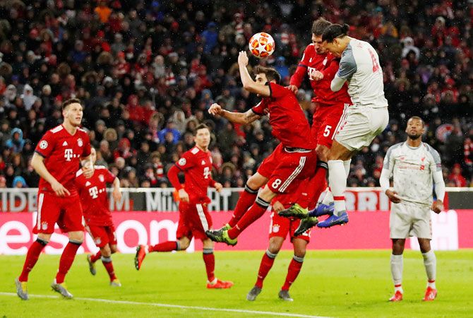 Liverpool's Virgil van Dijk scores their second goal
