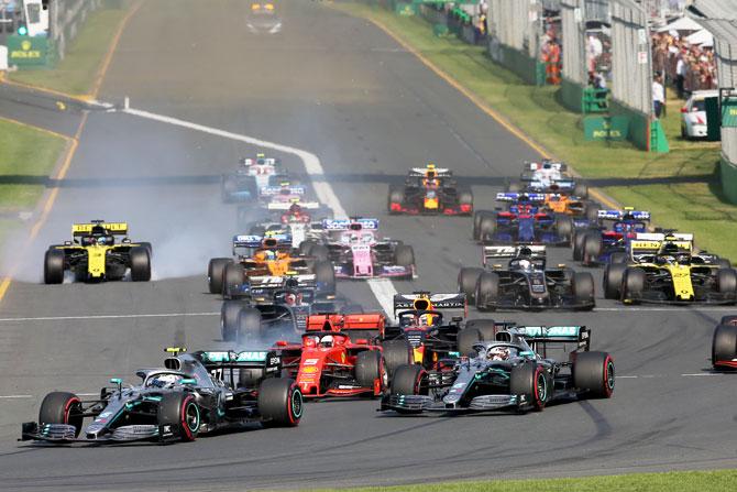 Valtteri Bottas driving the (77) Mercedes AMG Petronas F1 Team Mercedes W10 leads teammate Lewis Hamilton and the rest of the field at the start during the Australian F1 Grand Prix at Albert Park in Melbourne on Sunday