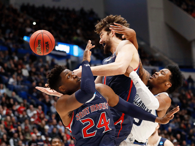 Villanova Wildcats forward Saddiq Bey (15) competes for a rebound with St. Mary's Gaels forward Malik Fitts (24) and forward Dan Sheets (15) during the second half of a game in the first round of the 2019 NCAA Tournament at XL Center in Hartford, Connecticut on Thursday, March 21