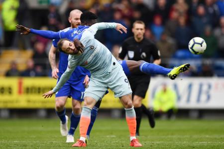 Chelsea's Gonzalo Higuain battles for possession with Cardiff City's Bruno Ecuele Manga during their EPL match in Cardiff on Sunday