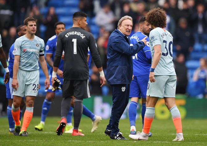 Cardiff manager Neil Warnock has words with Chelsea's David Luiz after the match