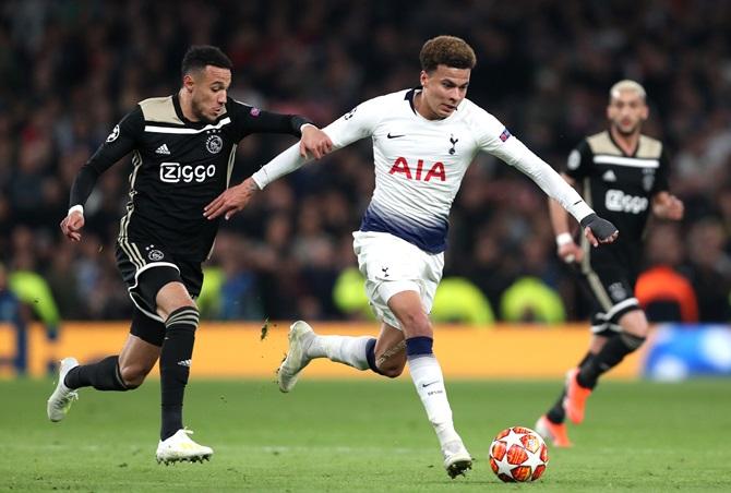 Tottenham's Dele Alli holds off Noussair   Mazraoui.