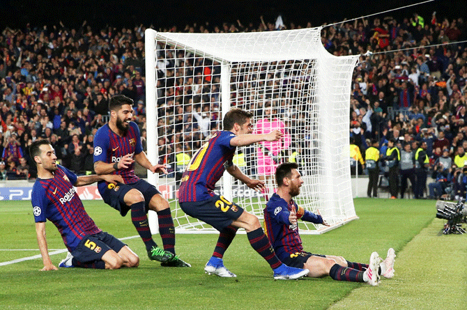 Barcelona's Lionel Messi celebrates scoring their third goal with Sergi Roberto, Luis Suarez and Sergio Busquets during their UEFA Champions League 2nd semifinal, 1st leg match at Camp Nou in Barcelona on Wednesday
