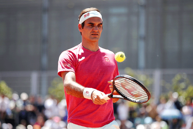 Switzerland's Roger Federer, who returns to clay court tennis after two years away, trains during the Mutua Madrid Open at La Caja Magica in Madrid, Spain, on Monday