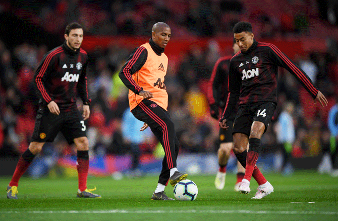 Manchester United's Ashley Young, Matteo Darmian and Jesse Lingard at a training session