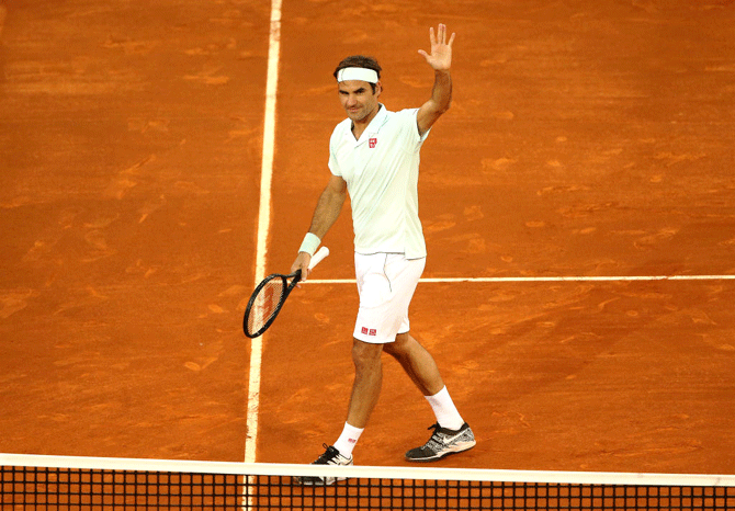 Switzerland's Roger Federer celebrates victory in his match against France's Richard Gasquet during the Madrid Open at La Caja Magica in Madrid, Spain, on Tuesday