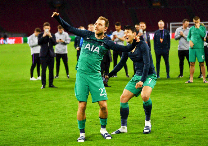 Tottenham's Christian Eriksen and Son Heung-min celebrate after the match