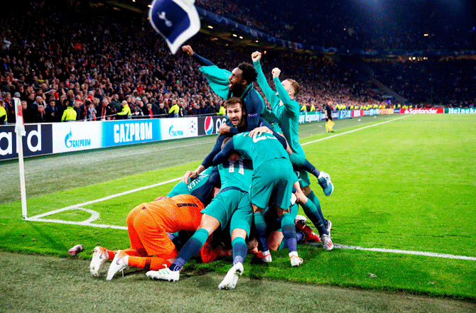Tottenham players celebrate after Lucas Moura scored their third goal to complete his hat-trick against Ajax Amsterdam at the John Cryuff Stadium in Amsterdam on Wednesday