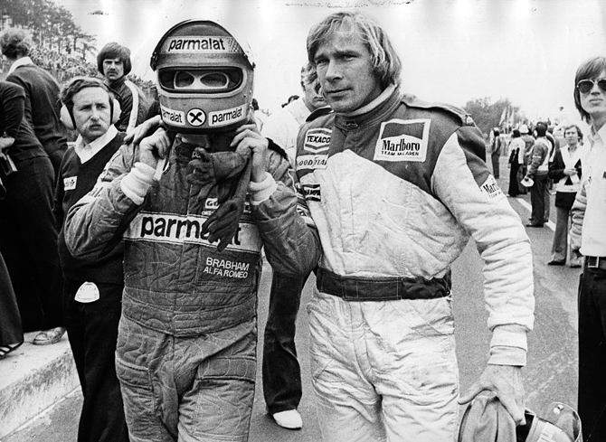 British racing driver James Hunt and Austrian Niki Lauda abandoning the race after they crashed into each other during an F1 race