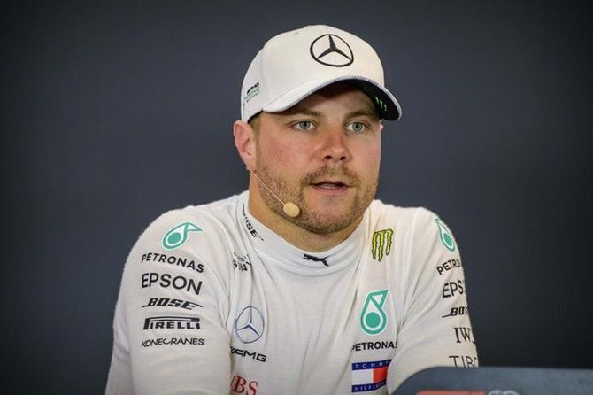 Mercedes AMG Petronas Motorsport driver Valtteri Bottas (77) of Finland speaks to the media after winning pole position in qualifying for the United States Grand Prix