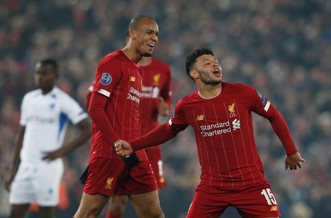 Alex Oxlade-Chamberlain celebrates scoring Liverpool's second goal in the Group E match against Genk