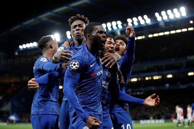 Reece James celebrates with teammates after scoring Chelsea's fourth goal against Ajax Amsterdam