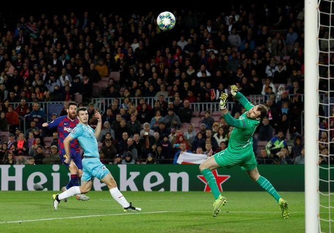 Slavia Prague's Ondrej Kolar saves a shot from Barcelona's Lionel Messi