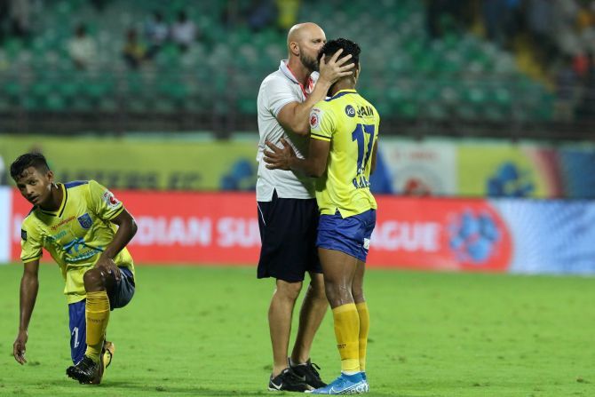 Kerala Blasters' coach Eelco Schattorie consoles his player after the team played out a goalless draw against Odisha FC in their Hero Indian Super League match at the Jawaharlal Nehru Stadium in Kochi on Friday
