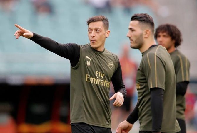 Arsenal's Mesut Ozil and Sead Kolasinac during training