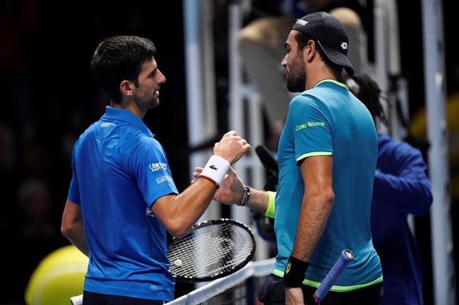 Novak Djokovic is congratulated by Matteo Berrettini after their group stage match. 