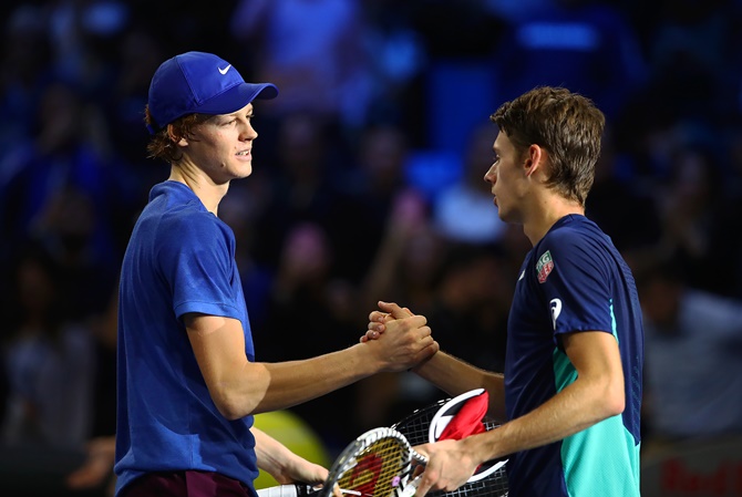 Italy's Jannik Sinner is congratulated by Alex de Minaur of Australia after his win in the final of the Next Gen ATP Finals