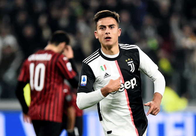 Juventus' Paulo Dybala celebrates scoring their first goal against AC Milan at the Allianz Stadium in Turin, on Sunday